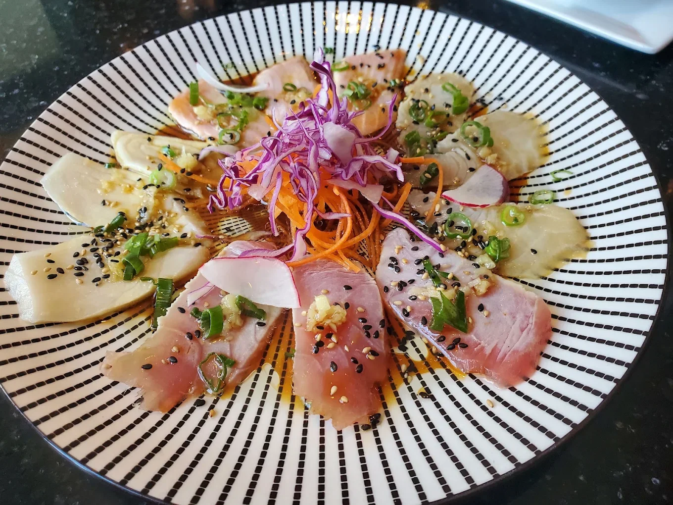 Assorted fish carpaccio and sashimi platter with radish and microgreens at Meal Set Bistro | Sushi, Academy Road Winnipeg