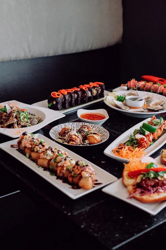 Table spread of assorted sushi rolls and Japanese small plates at Meal Set Bistro | Sushi, River Heights Winnipeg