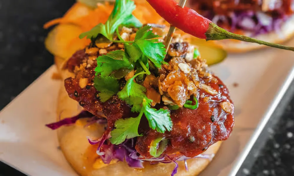 Kode Red bao with crispy chicken and fresh cilantro at Meal Set Bistro | Sushi, River Heights Winnipeg